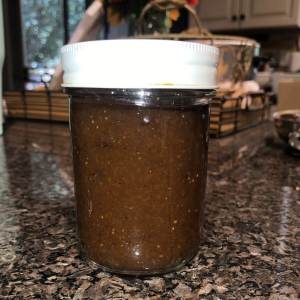 photo of an unlabeled jar of salsa on a kitchen counter